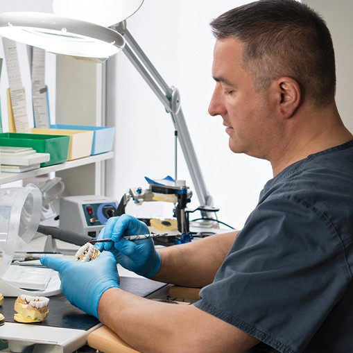 Oshkosh technician making dentures