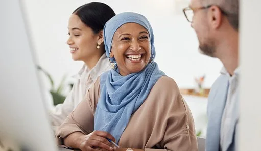 Woman smiling at coworker in office