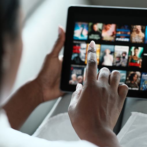 Dental patient watching videos on tablet computer