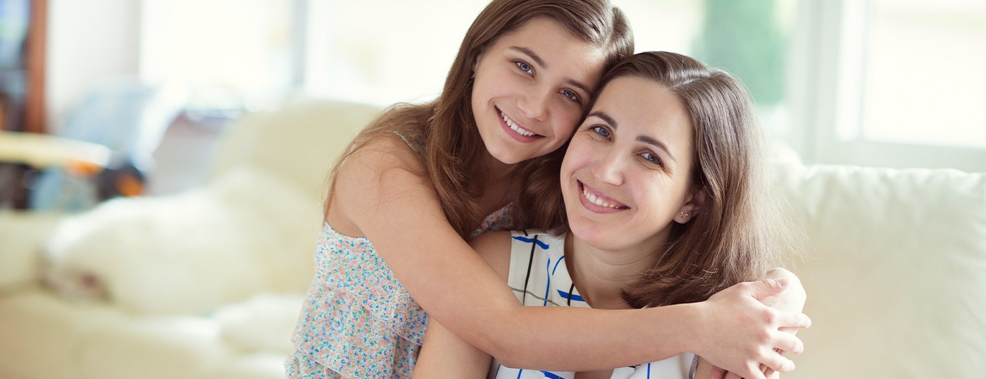 Smiling mother and daughter after children's dentistry visit