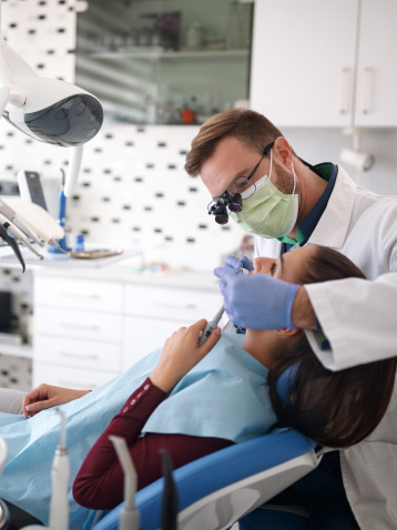 Doctor Heil treating dental patient