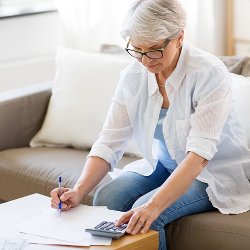 Woman filling out dental insurance forms