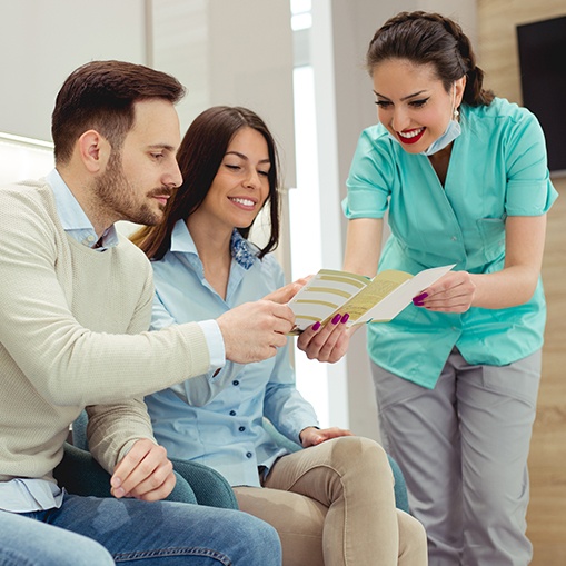 Team member giving patient dental insurance information