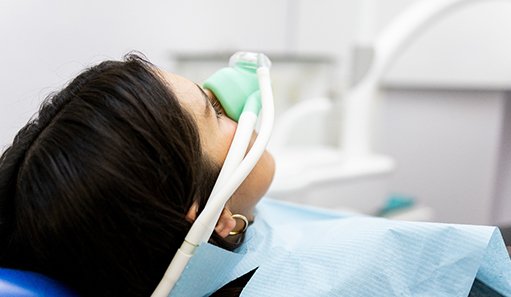 Woman relaxing while breathing in nitrous oxide