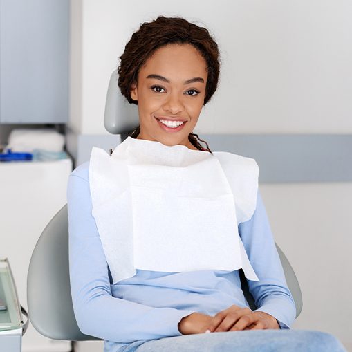 Woman in dental chair for preventive dentistry checkup