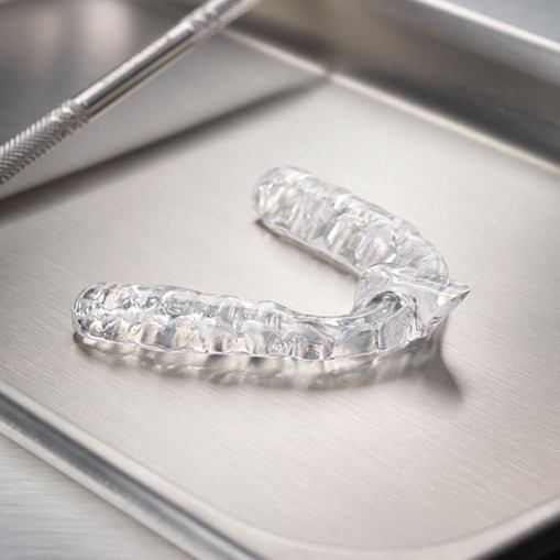 Clear nightguard for bruxism on metal tray