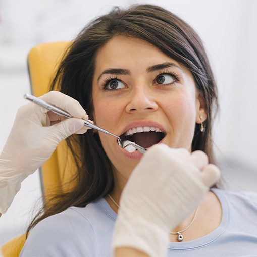 Woman receiving root canal therapy