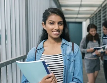 Young woman with gorgeous smile after Invisalign treatment