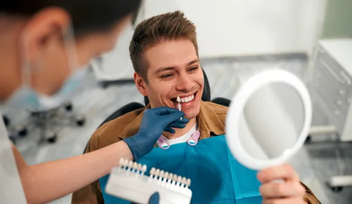 Patient in Oshkosh talking to dentist about teeth whitening