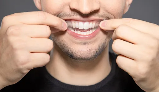 Patient in Oshkosh using teeth whitening strips