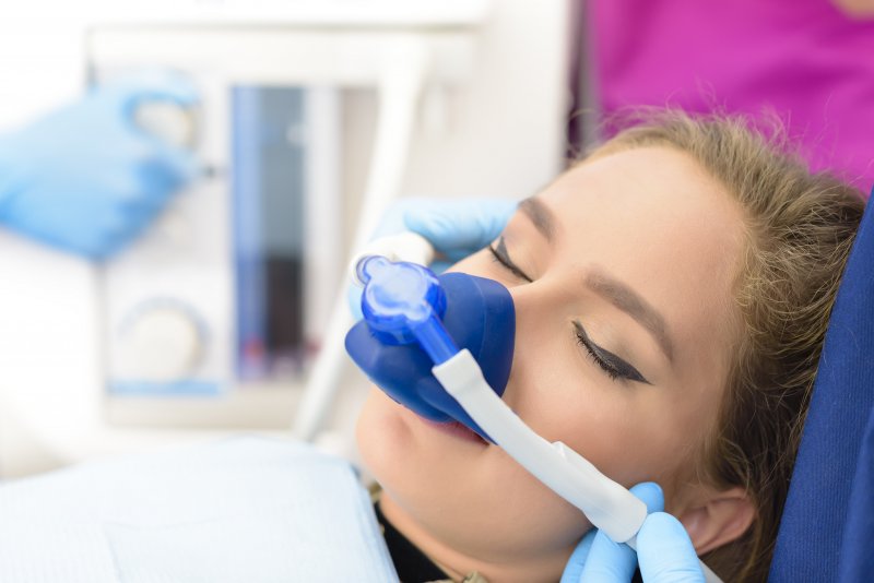 a woman undergoing nitrous oxide sedation during an appointment