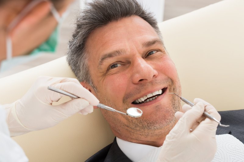 Patient smiling at dentist in Oshkosh