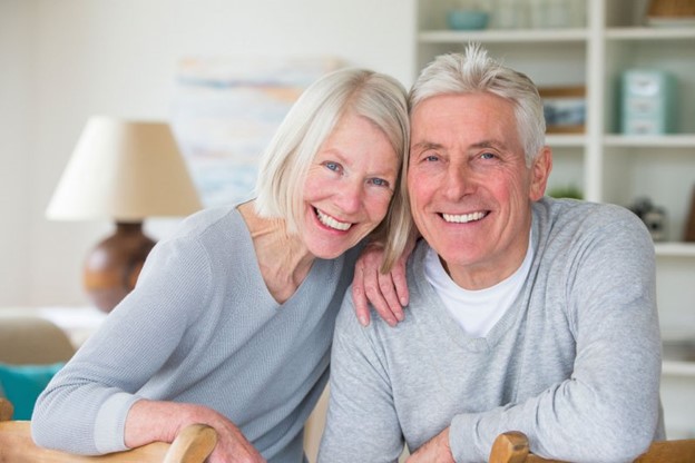 Senior couple smiling.