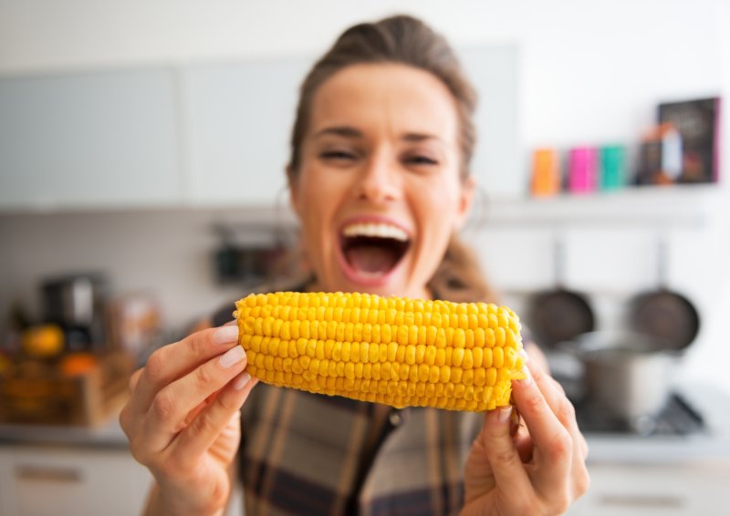 woman eating corn on the cob in Oshkosh