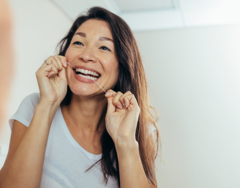 Woman flossing
